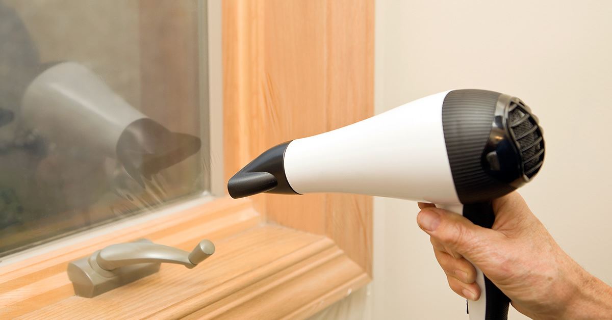 Hair Dryer blow drying a window